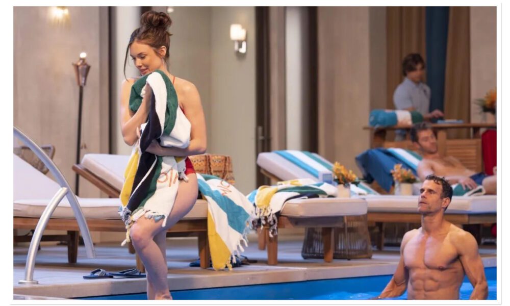 Drew Cain emerging from pool as Willow Tait watches on General Hospital